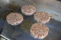 Grilling hamburger meat on board