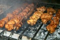 Grilling marinated shashlik on a grill. Shashlik is a form of Shish kebab Royalty Free Stock Photo