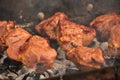 Grilling marinated shashlik on a grill. Shashlik is a form of Shish kebab popular in Eastern, Central Europe Royalty Free Stock Photo