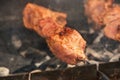 Grilling marinated shashlik on a grill. Shashlik is a form of Shish kebab popular in Eastern, Central Europe Royalty Free Stock Photo