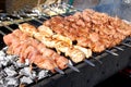 Grilling marinated shashlik on a grill. Shashlik is a form of Shish kebab popular in Eastern, Central Europe and other places. Royalty Free Stock Photo