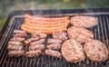 Grilling Meat on barbecue grill with coal. Royalty Free Stock Photo