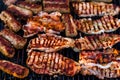 Grilling  pork chops on barbecue grill. BBQ in the garden Royalty Free Stock Photo