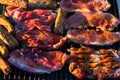 Grilling  pork chops on barbecue grill. BBQ in the garden Royalty Free Stock Photo