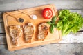 Grilling pork steaks on cutting board. Top view. Royalty Free Stock Photo