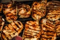 Grilling pork steaks. Delicious meat steaks close up cooking on the barbecue grill Royalty Free Stock Photo