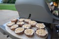 Grilling portobello mushrooms on cedar plank Royalty Free Stock Photo