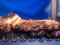 Grilling red meat and sausages at sunset outdoors gathering with