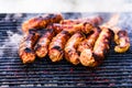 Grilling sausages on barbecue grill. Delicious sausages on charcoal grill