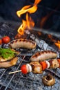 Grilling sausages on barbecue grill.