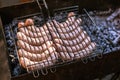 Grilling sausages in barbecue. Party time. Royalty Free Stock Photo