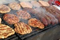 Grilling Sausages, Burgers, Pork Steak On Barbecues Gas Grill For Party. Hot Dogs,sausages And Hamburgers On A Barbeque, Bbq. Smok