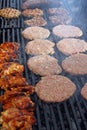 Grilling sausages, burgers, pork steak on barbecues gas grill for party. Hot dogs,sausages and hamburgers on a barbeque, bbq. Smok