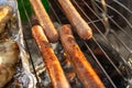 Grilling sausages on the grill grate, close-up. Grilling food, bbq,