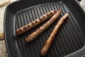 Grilling sausages