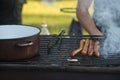 Grilling sausages charcoal fire