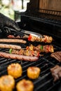 Grilling sausages skewers and corn on a barbecue Royalty Free Stock Photo