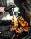 Grilling sausages skewers and corn on a barbecue Royalty Free Stock Photo