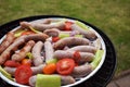 Grilling sausages and vegetables and spices on the grill Royalty Free Stock Photo