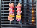 Grilling shish kabobs on a bbq Royalty Free Stock Photo
