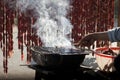 Grilling skewer sausage in mekong delta