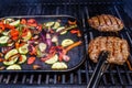 Grilling steak with a variety of summer vegetables