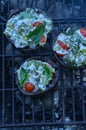 Grilling stuffed Portobello mushrooms on outdoor grill Royalty Free Stock Photo