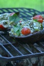 Grilling stuffed Portobello mushrooms on outdoor grill Royalty Free Stock Photo