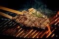 Grilling a tasty tender t-bone steak on the fire Royalty Free Stock Photo