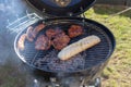 Grilling time! Grill, garden, green grass and good weather Royalty Free Stock Photo