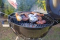 Grilling time! Grill, garden, green grass and good weather Royalty Free Stock Photo