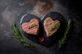 Grilling Two Heart-Shaped Marble Beef Steaks with Spices on a Stone Background. Generative AI