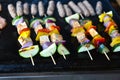 Grilling vegetables and vegan, vegeterian skewers or kebabs Royalty Free Stock Photo
