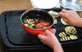 Grilling vegetables, womens hand