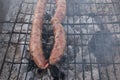 Grilling wursts on barbecue grill. Grilled meat sausages