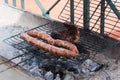 Grilling wursts on barbecue grill. Grilled meat sausages