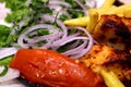 Grills - shish tawook - onions - tomatoes - chips - delicious food - healthy food