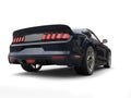 Grim blue urban muscle car - back view Royalty Free Stock Photo