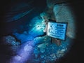 Grim reaper sign warns divers not to enter the cave zone in the underwater cavern of Paradise Springs, Florida Royalty Free Stock Photo