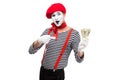 grimacing mime pointing on money