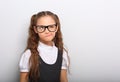 Grimacing pupil girl with long hair style in fashion eyeglasses