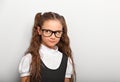 Grimacing pupil girl with long hair style in fashion eyeglasses