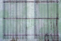 Grimbergen, Flemish Brabant Region, Belgium - Metal grid patterns against a worn concrete wall