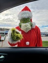 Grinch wearing a mask