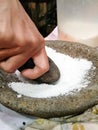 grind the salt with a stone mortar