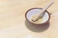 Grind the white sesame seeds with a wooden bowl in a grinding bowl. Royalty Free Stock Photo