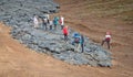 A unique natural attraction. People are walking over the new lavafield of the volcano eruption Royalty Free Stock Photo