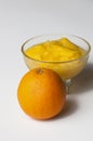 Grinded orange in bowl isolated on a white background.Fruit.Copy space Royalty Free Stock Photo