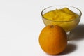 Grinded orange in bowl isolated on a white background.Fruit.Copy space Royalty Free Stock Photo