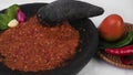 Grinded Red Chili Pepper on a Mortar and Pestle Royalty Free Stock Photo